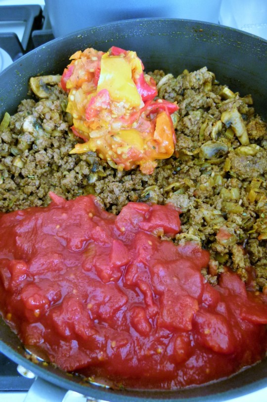 MissFoodFairy's beef pot pies adding tomatoes & peperonata