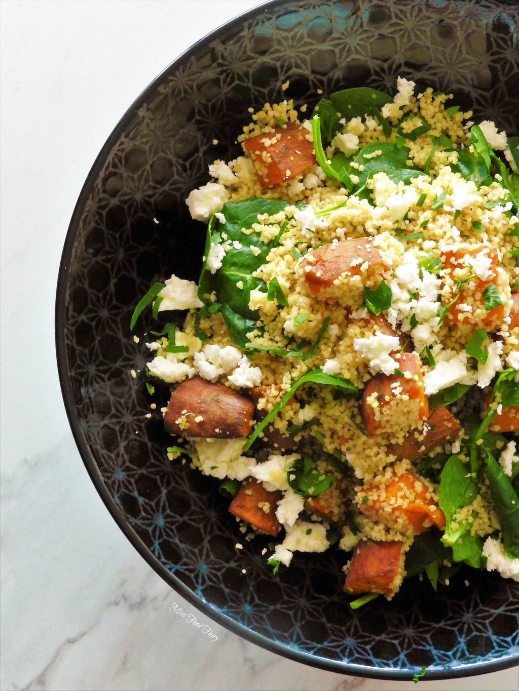 Roast sweet potato and spinach couscous salad with crispy skin salmon
